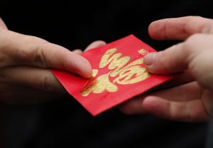 A red envelope is given out during Chinese Lunar New Year celebrations in Liverpool, northern England